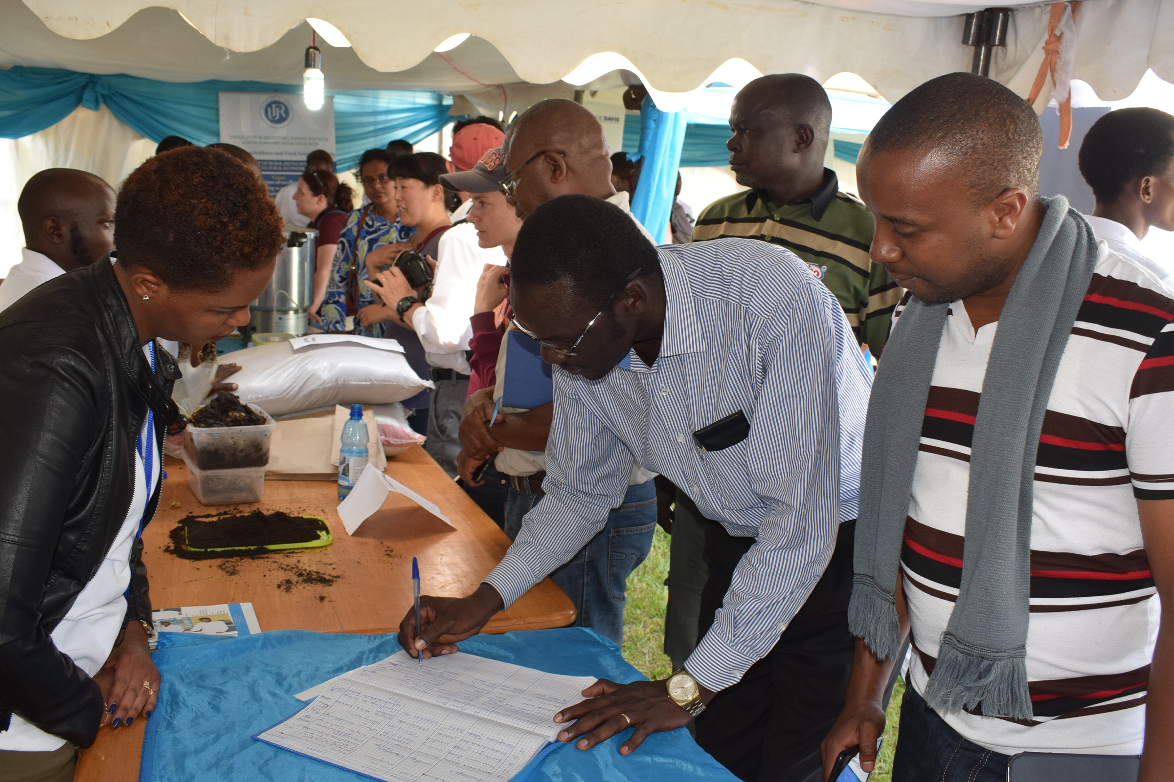 Staff engaging with visitors at a College of Education programmes event